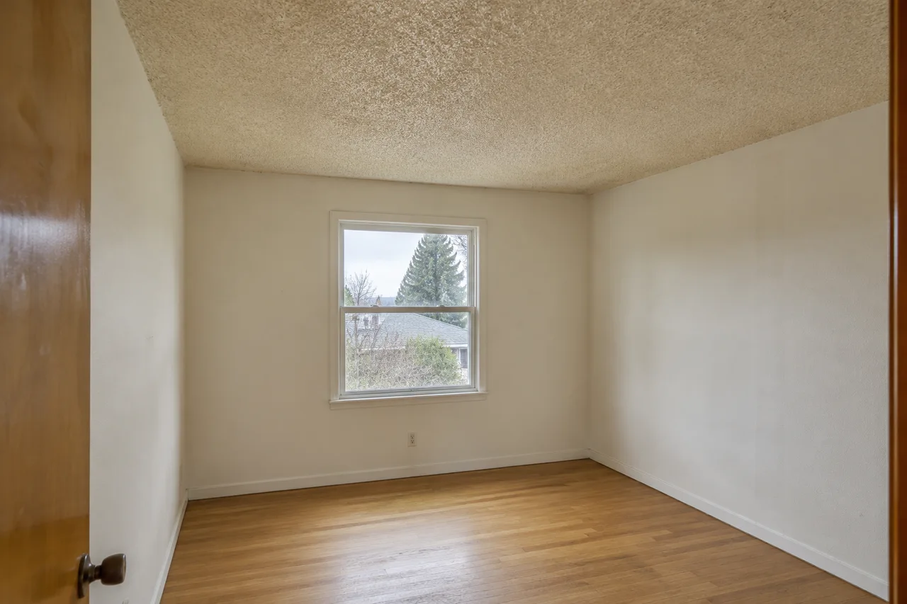 A room with raised popcorn texture across the ceiling.